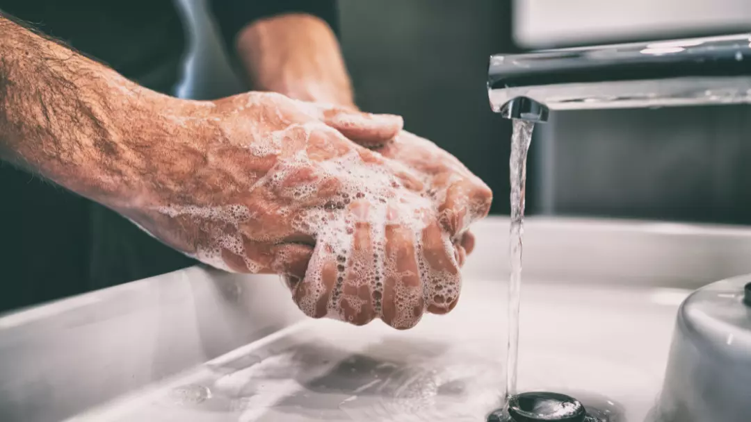 employee washing hands