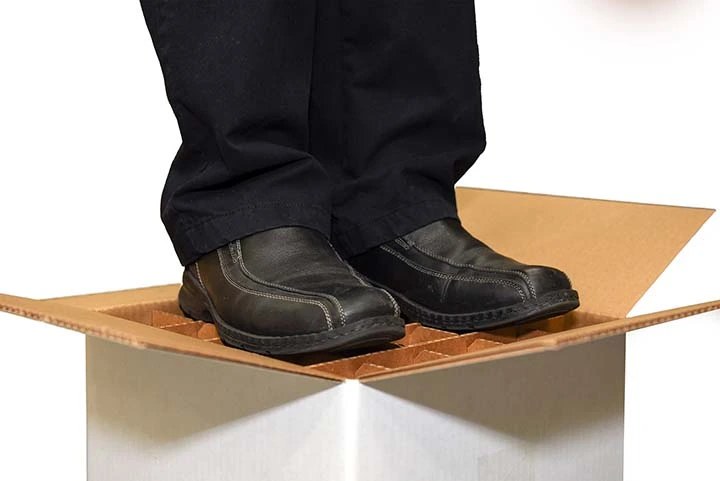 man standing on corrugated box designed with dividers